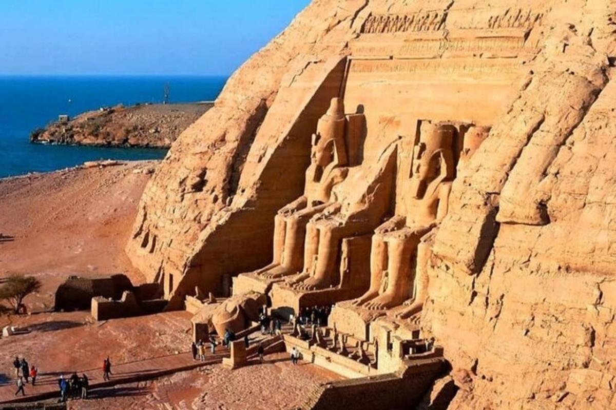 a large sand castle on the side of a cliff