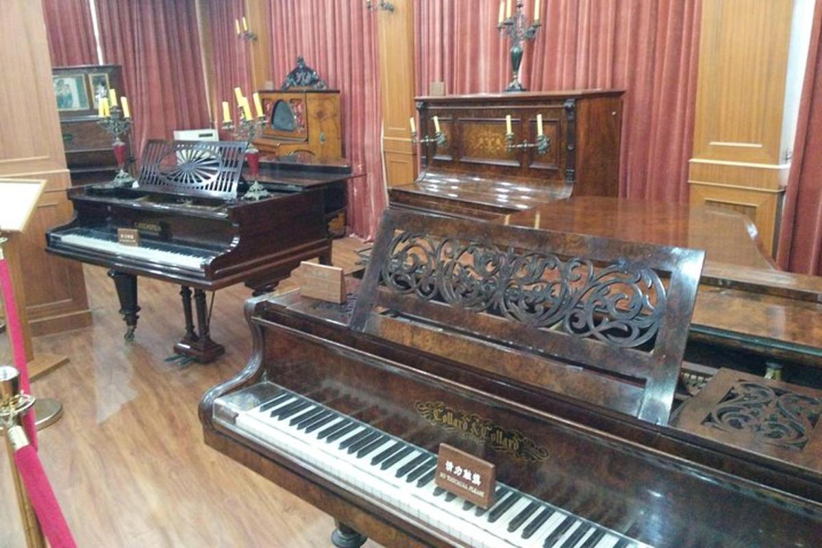 a room with three pianos in a room