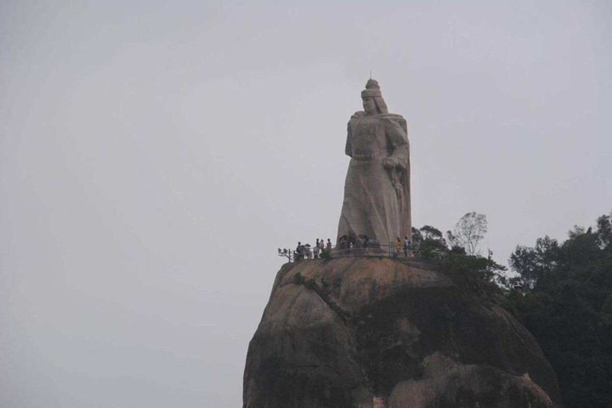 a statue on the top of a mountain