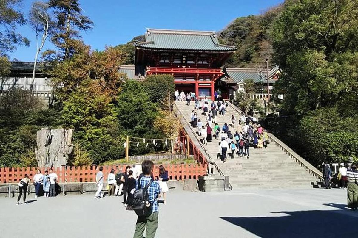 a group of people walking down stairs in front of a building