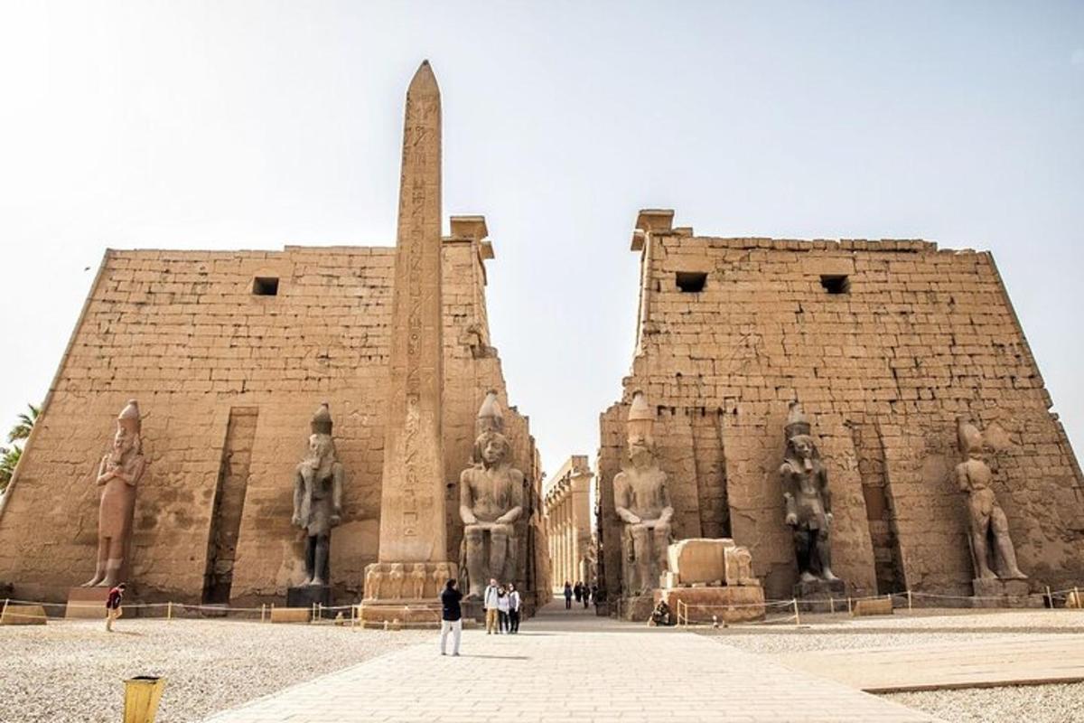 a large building with statues on the side of it