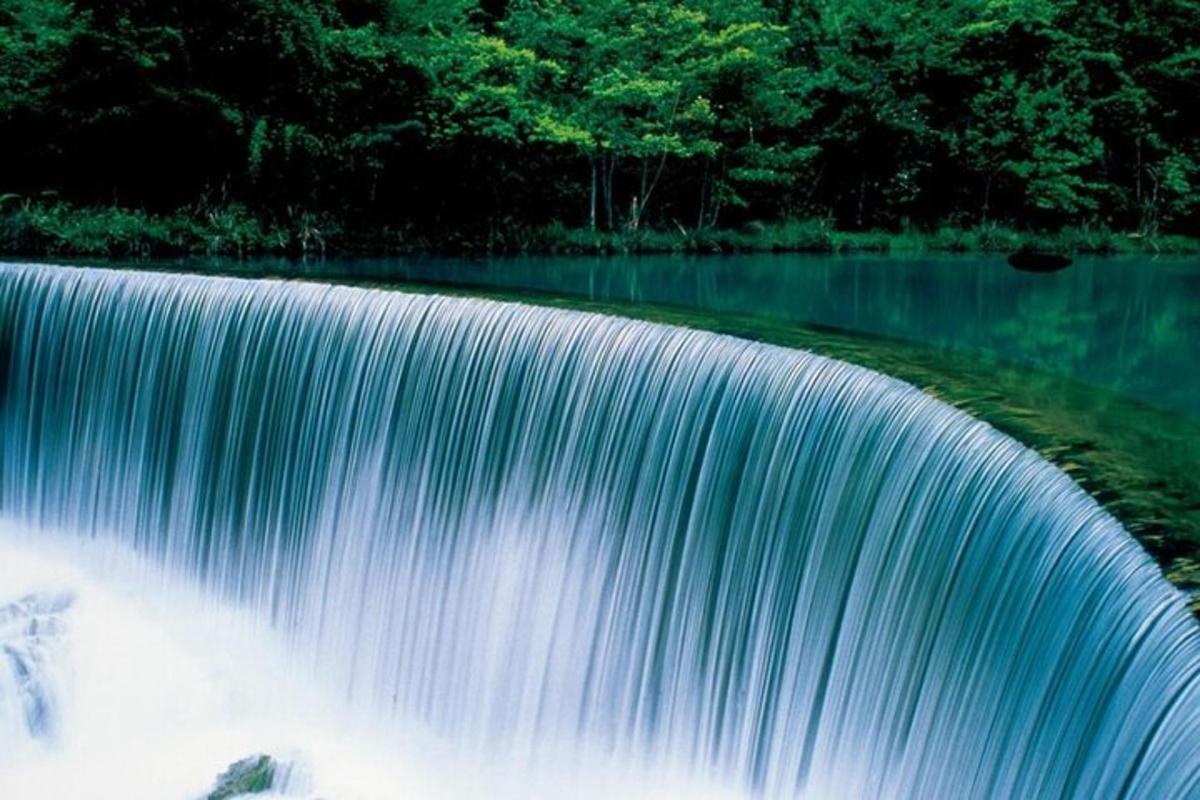 a waterfall in a body of water