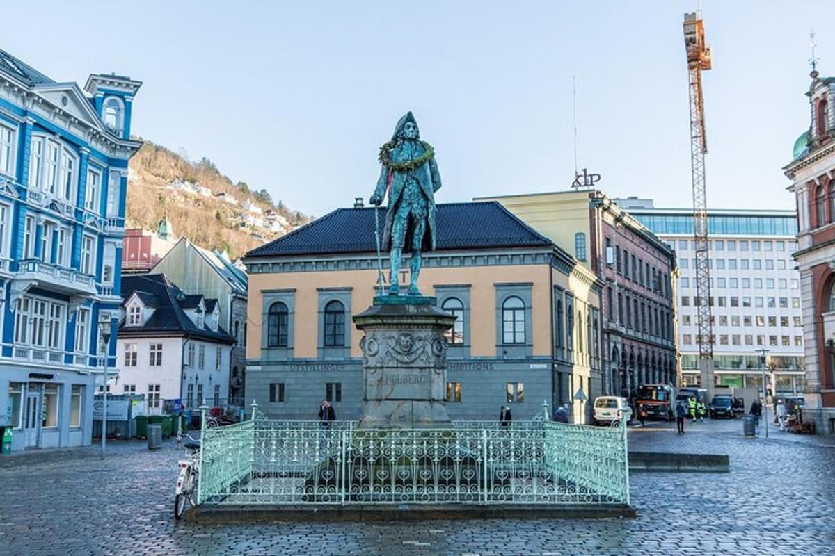 a statue in front of a building in a city