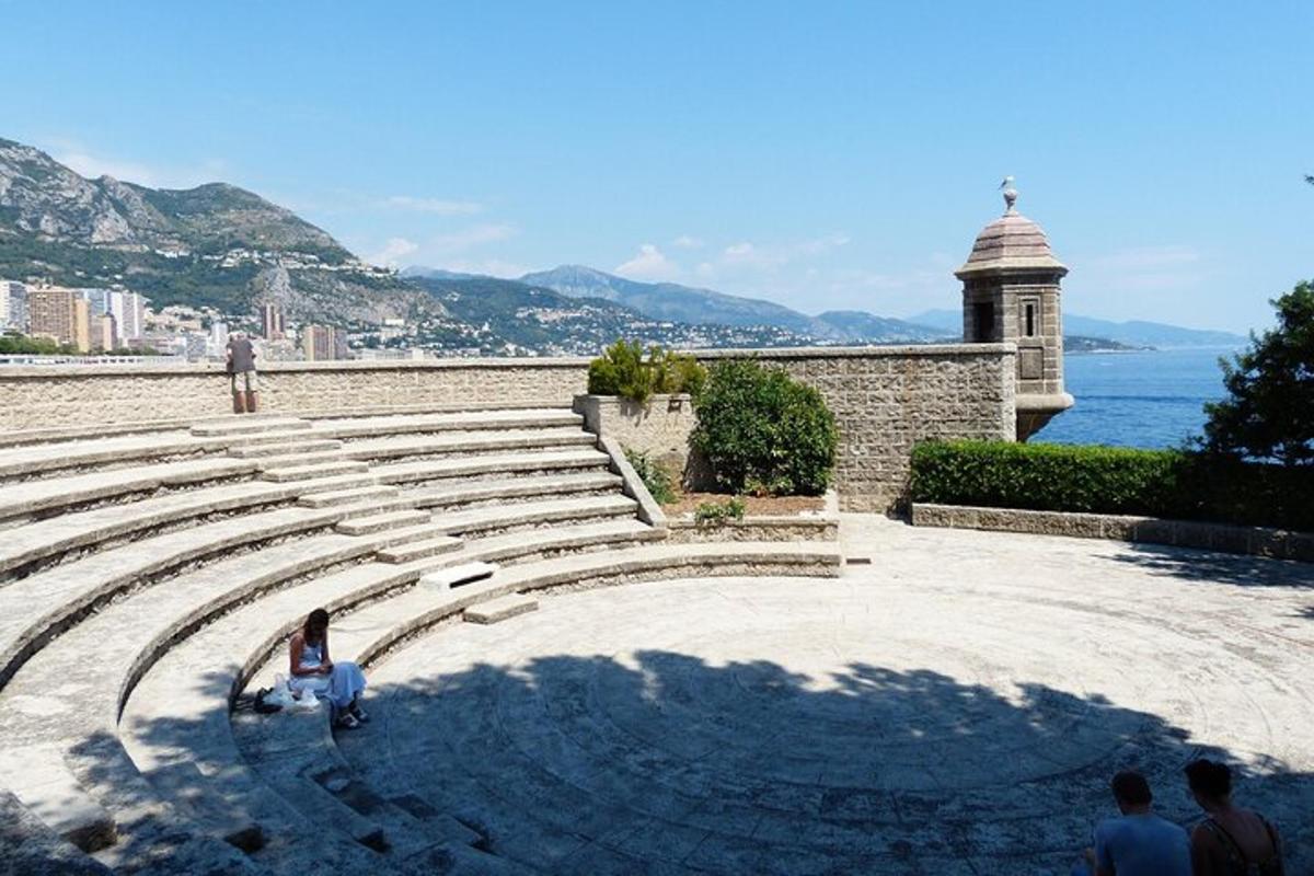a group of people standing in an amphitheater
