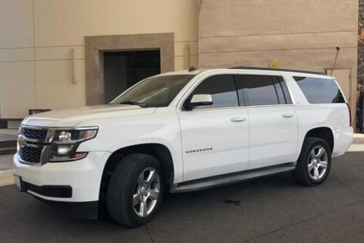 a white truck parked in a parking lot