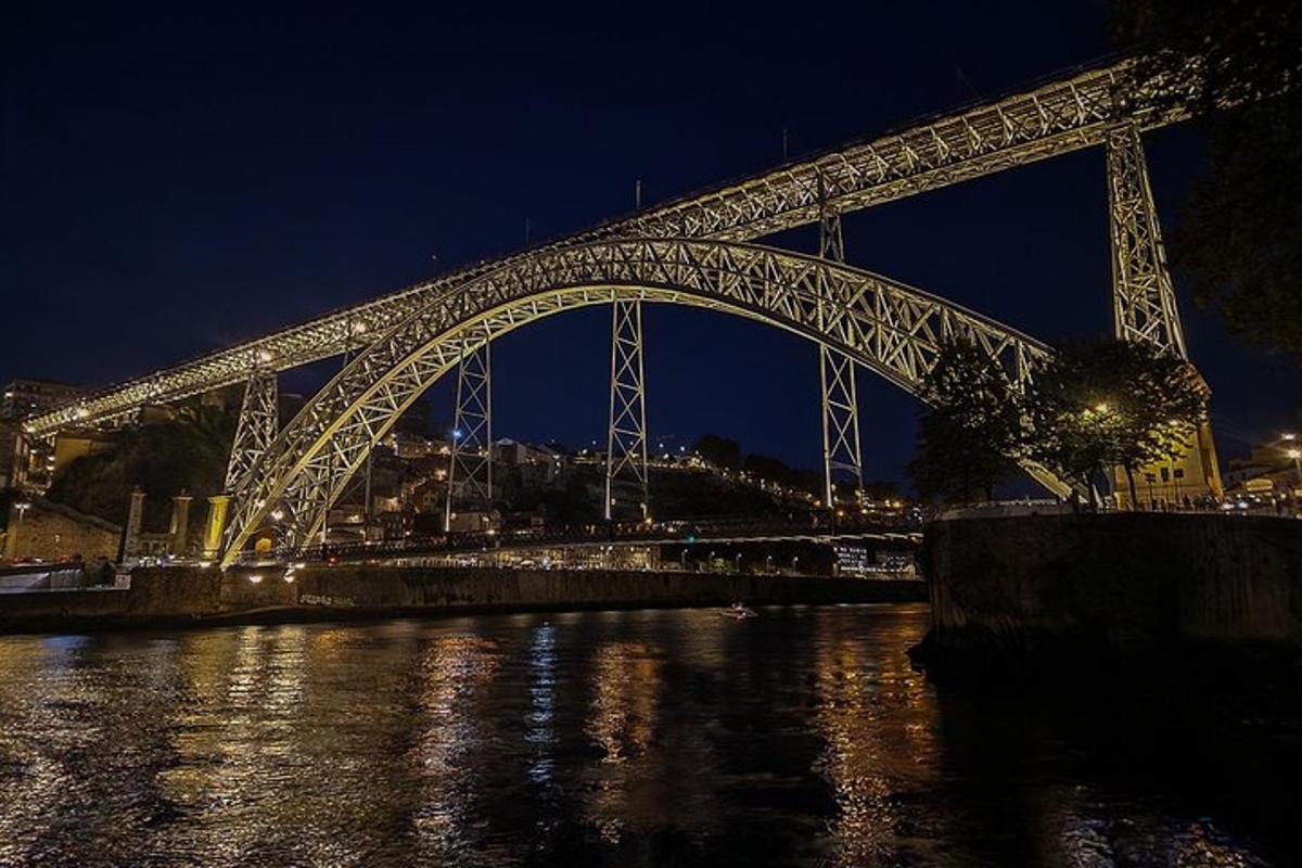 a large bridge over the water at night