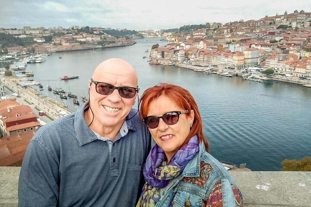 a man and a woman standing on top of a city