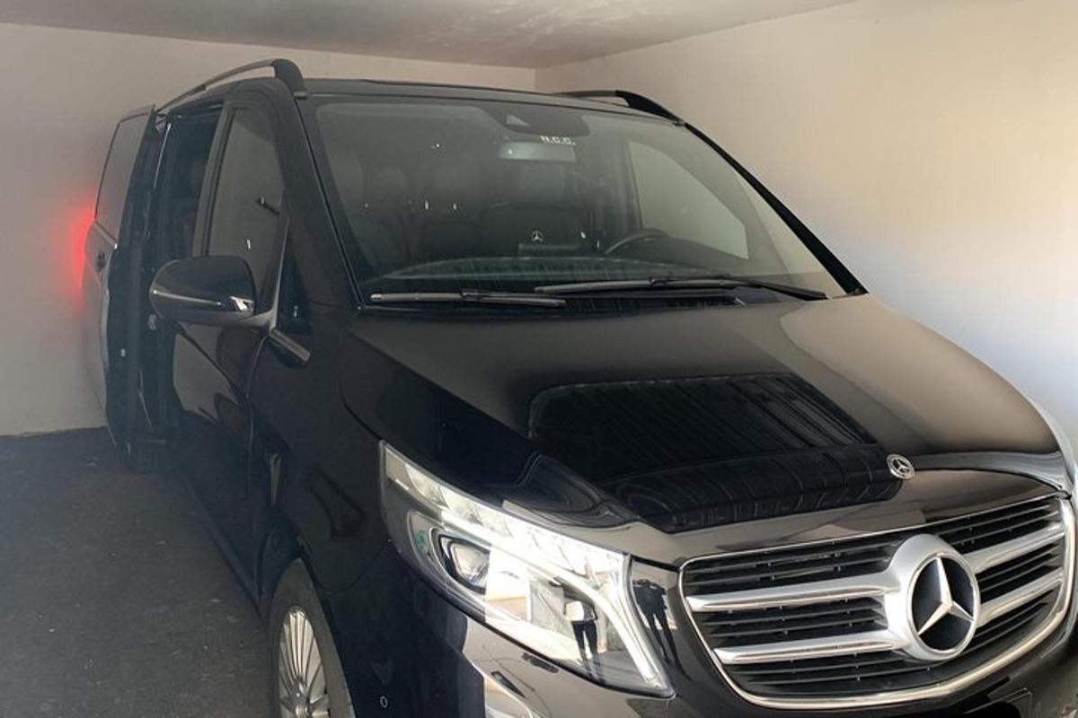 a black van is parked in a garage