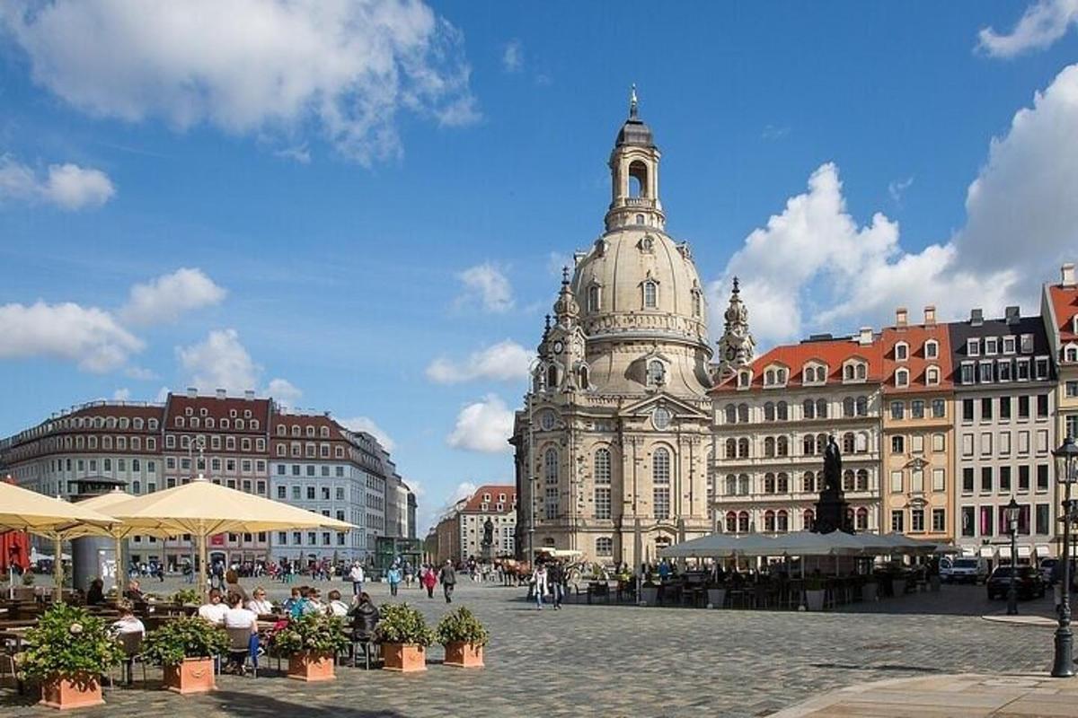 a city square with a clock tower and buildings