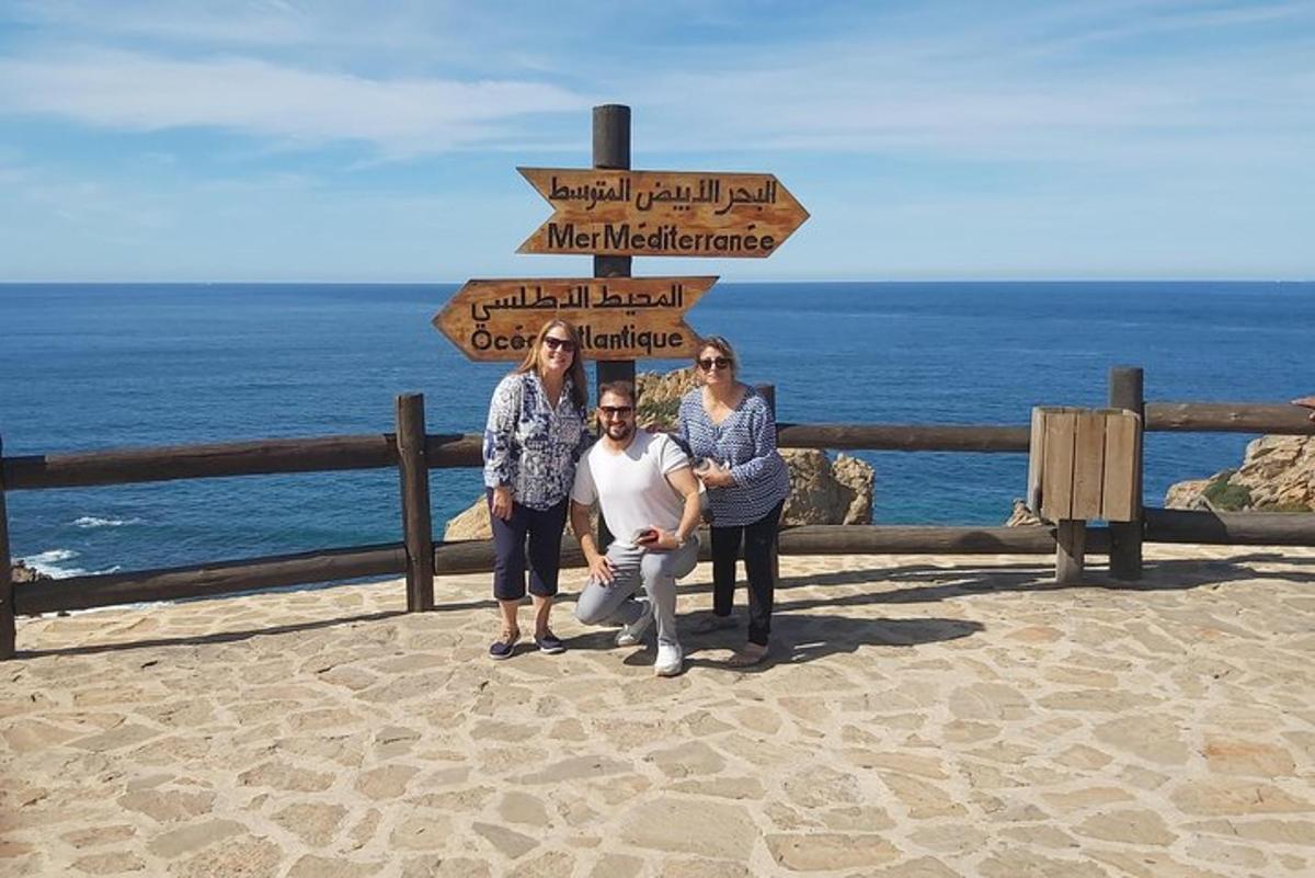 a group of people standing in front of a sign