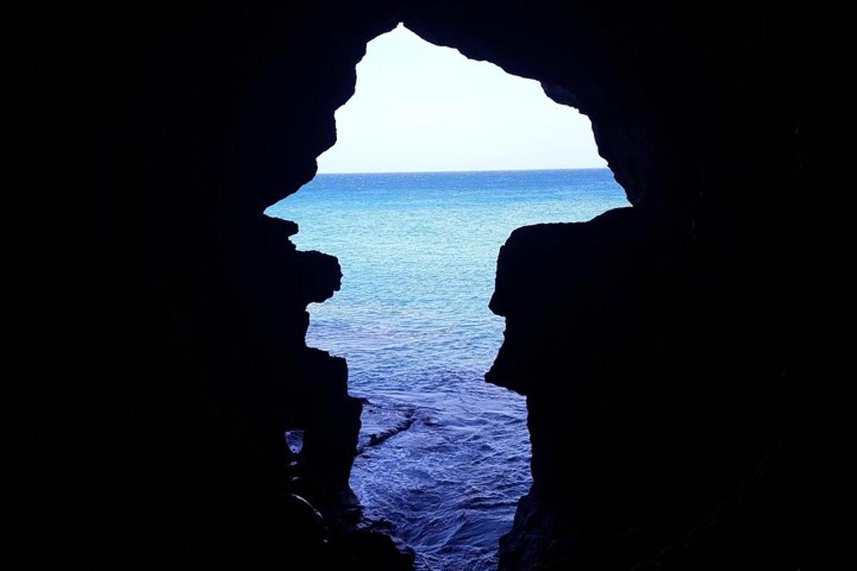 a view of the ocean from a cave