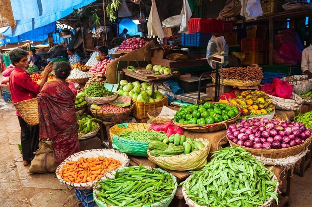 a market with baskets of fruits and vegetables on display