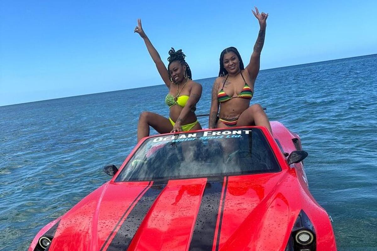 two women sitting on top of a boat in the water
