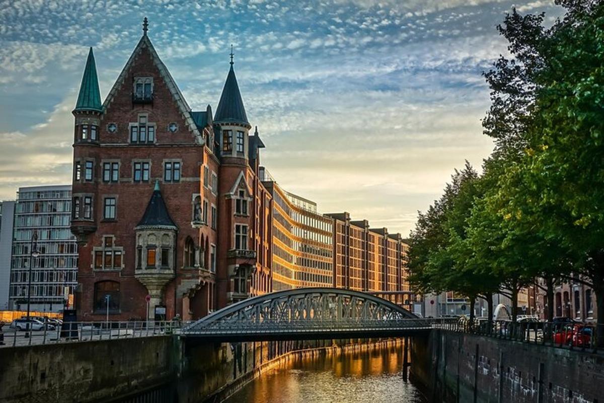 a bridge over a river in front of a building