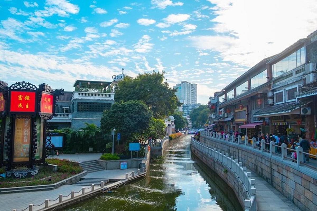 a river in the middle of a city with buildings
