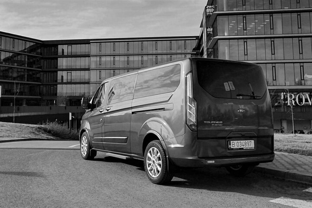 a black van parked in front of a building