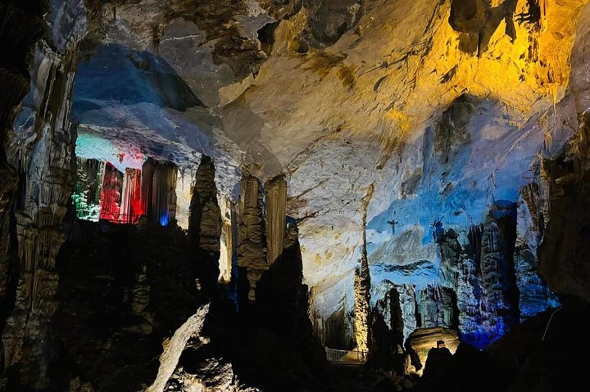 a cave with a painting on the side of it