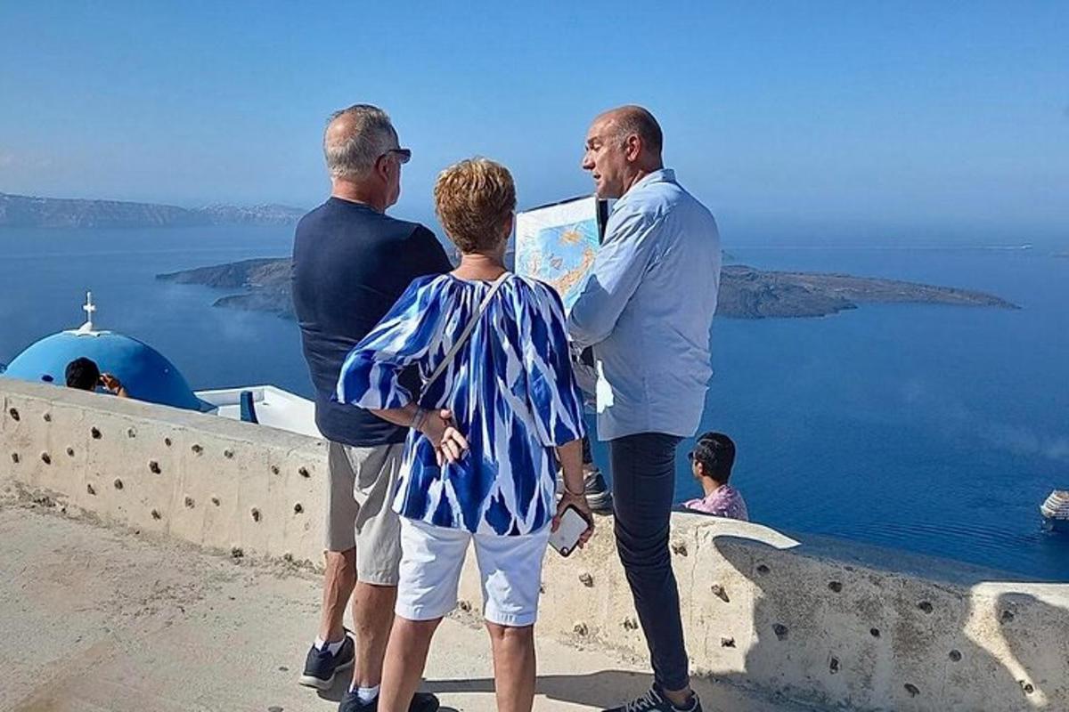 three men and a woman looking out over the ocean