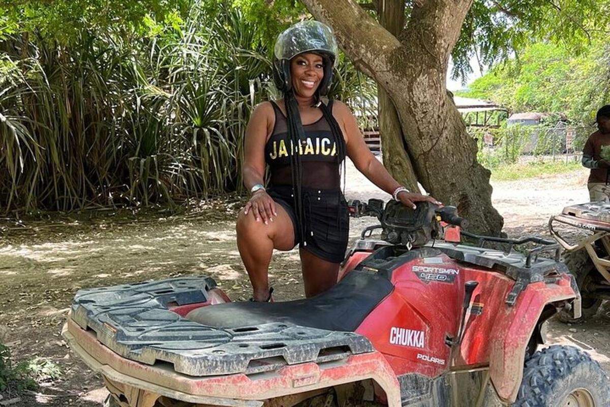 isang babae ang nakatayo sa tabi ng isang quad bike