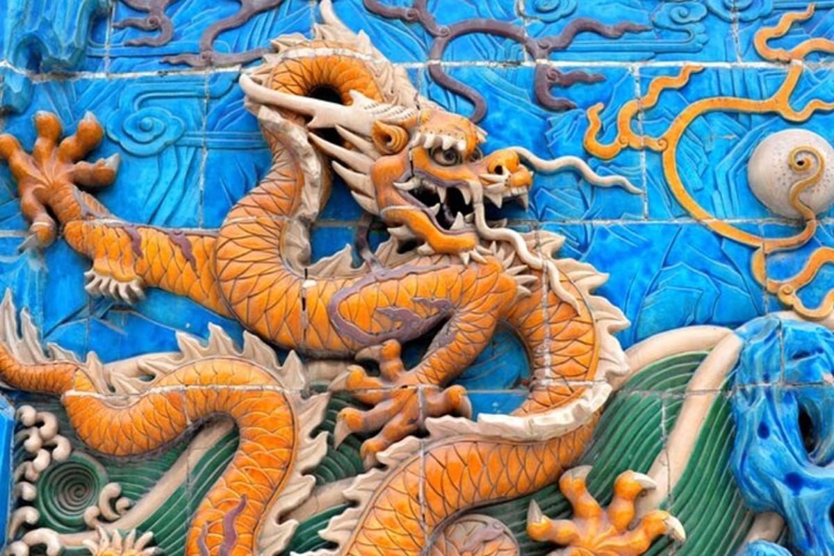 a chinese dragon on the side of a building