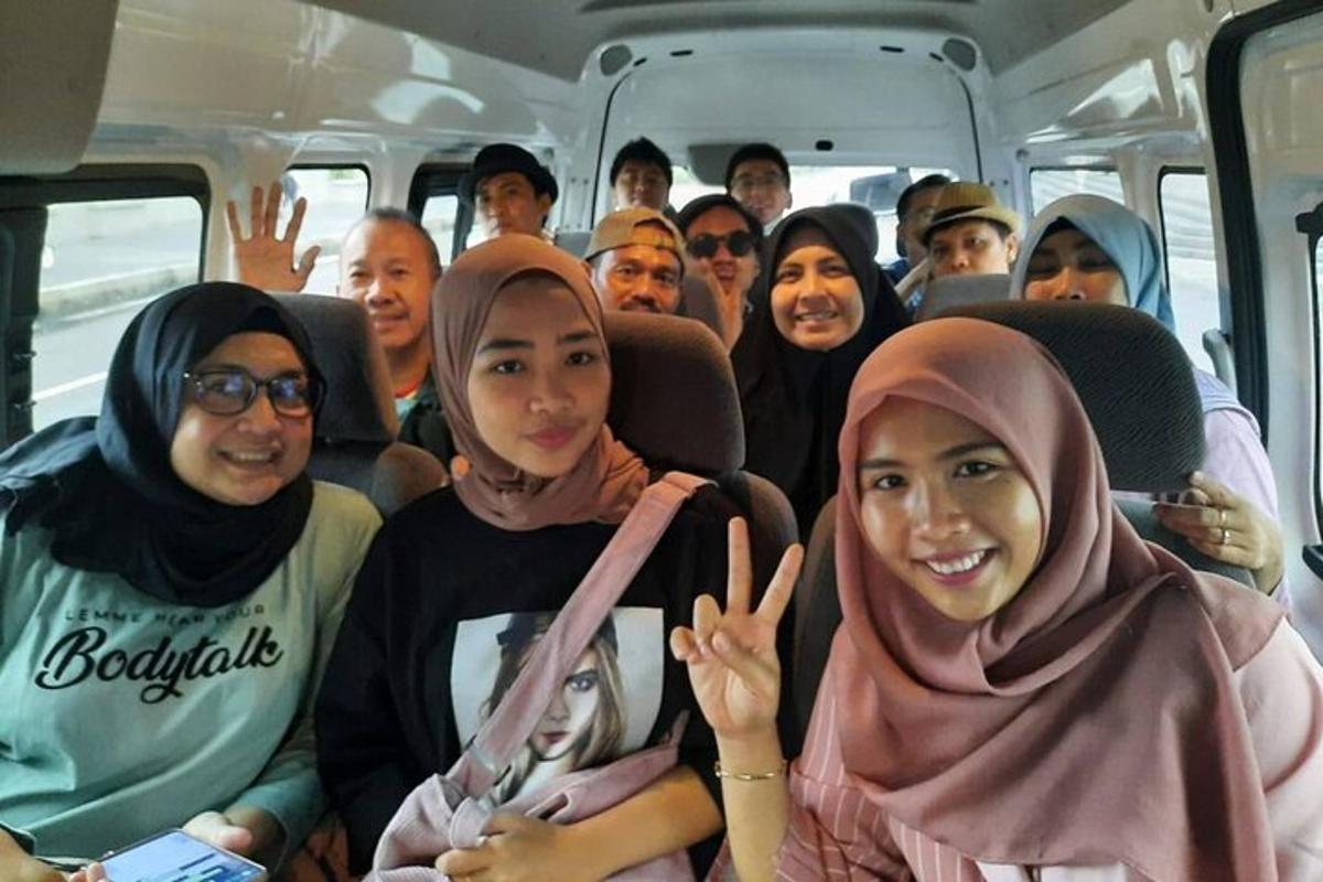 a group of people sitting inside of a bus