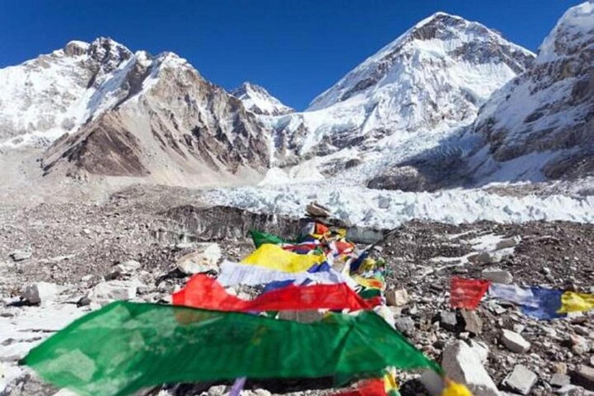 a mountain with a pile of flags and snow