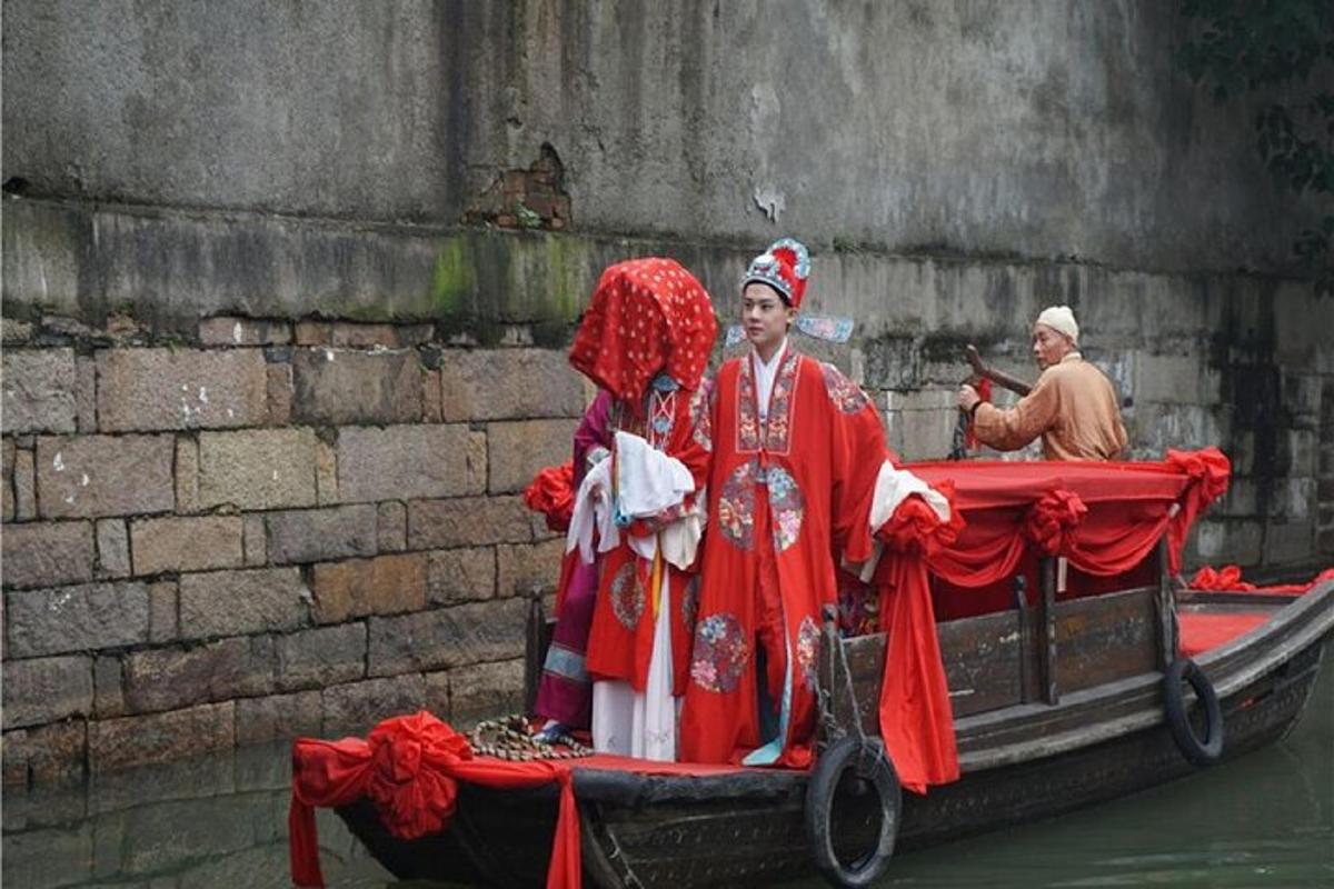 two people in costumes on a boat in the water
