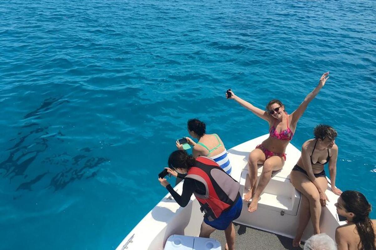 a group of people on a boat in the water