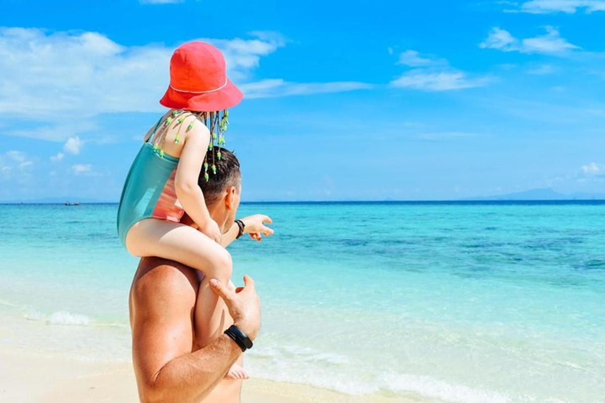 a man carrying a woman on the beach