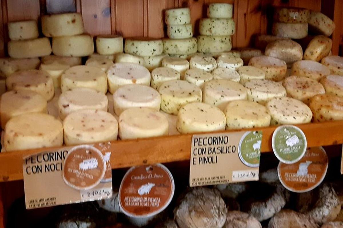 a display of cheeses for sale in a bakery