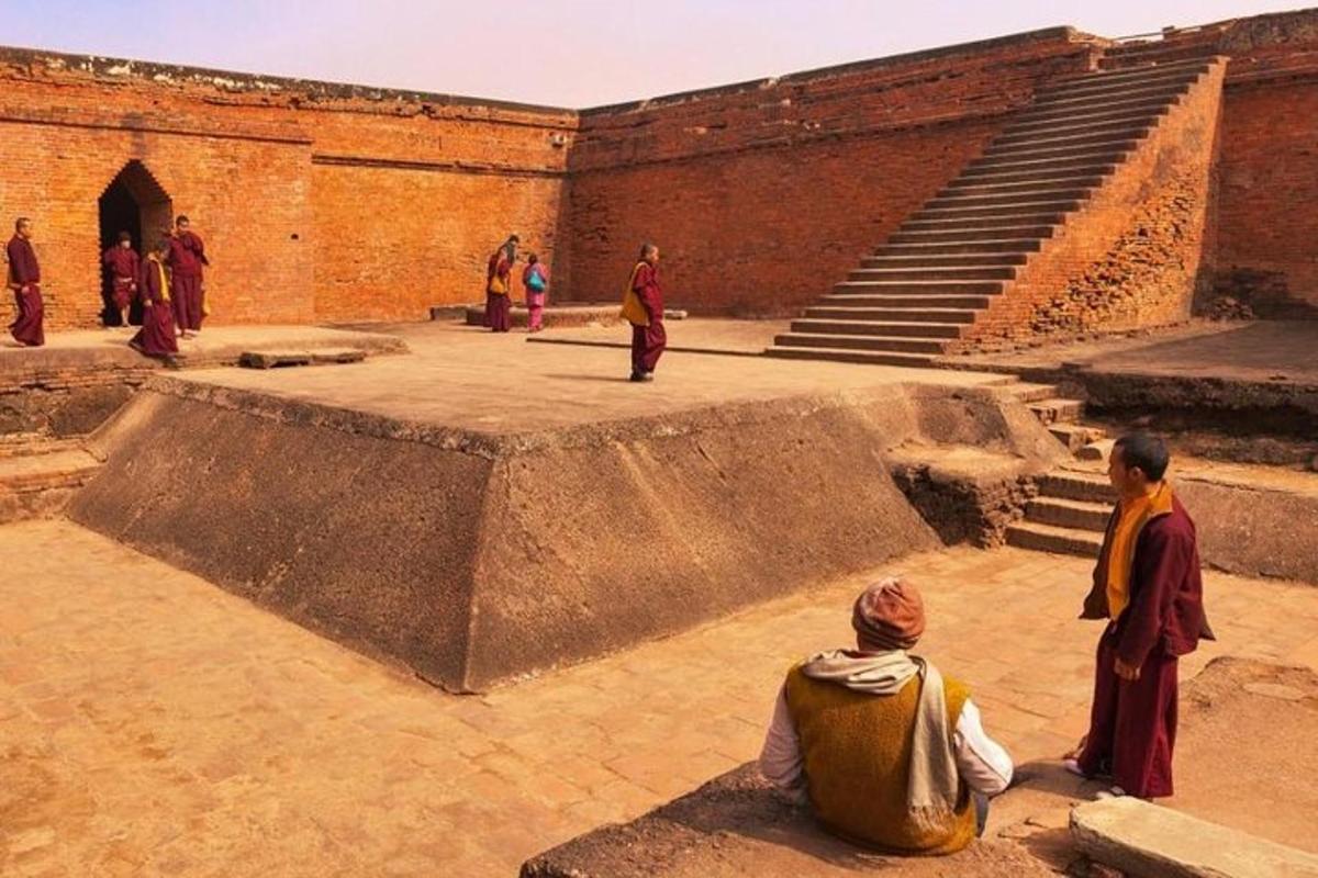 a group of people sitting in front of a building