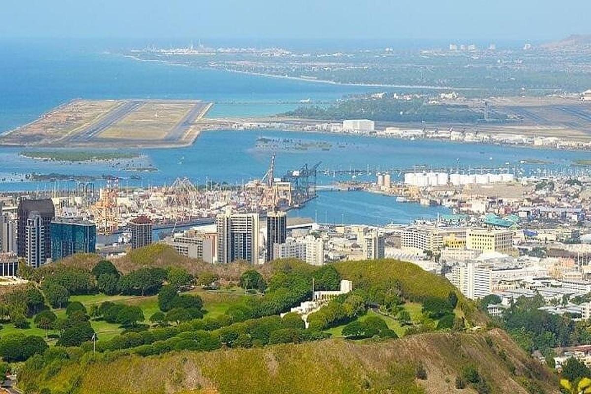 an aerial view of a city and a body of water