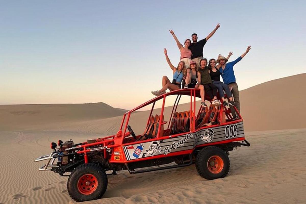 a group of people sitting on top of a jeep in the desert