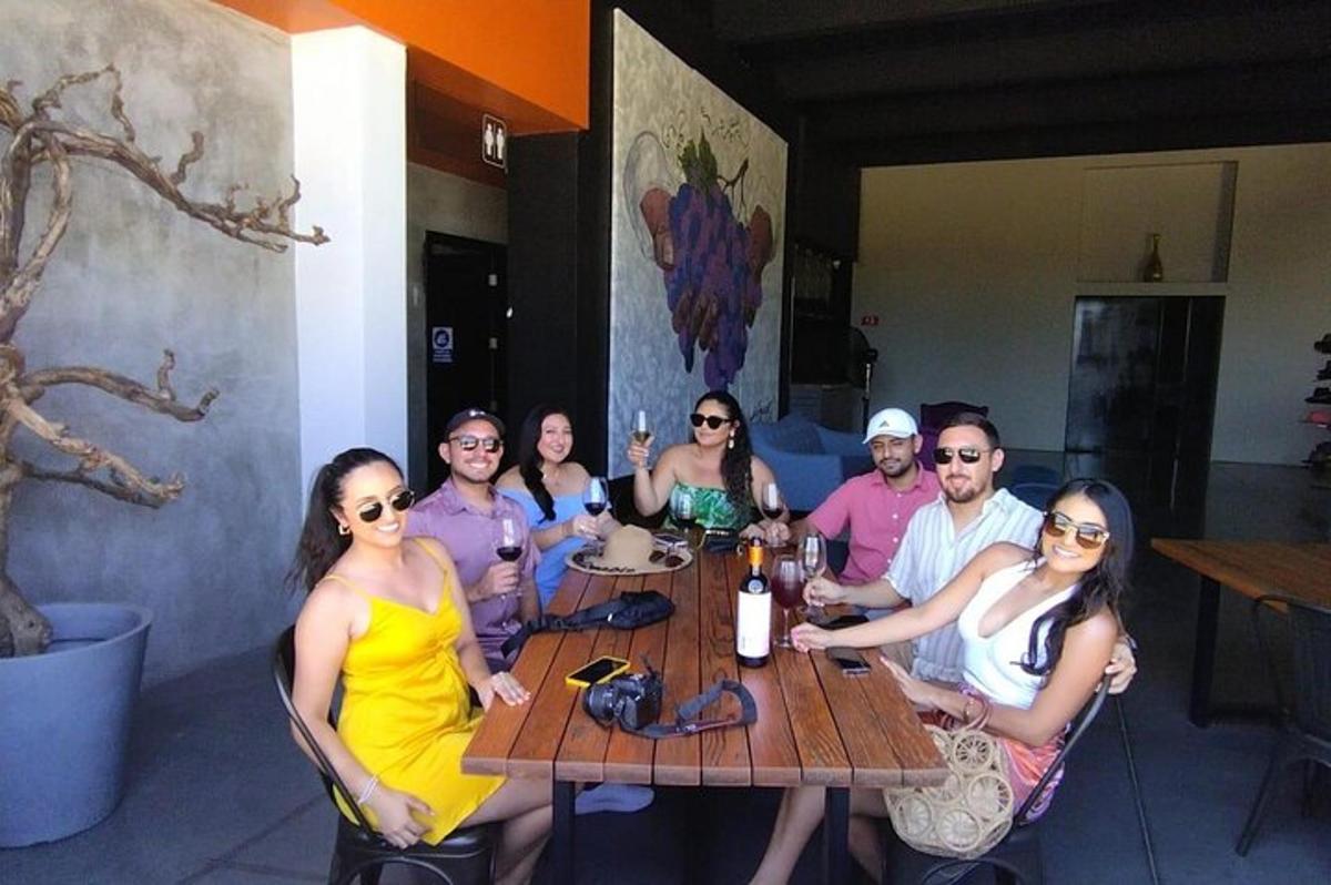 a group of people sitting around a wooden table