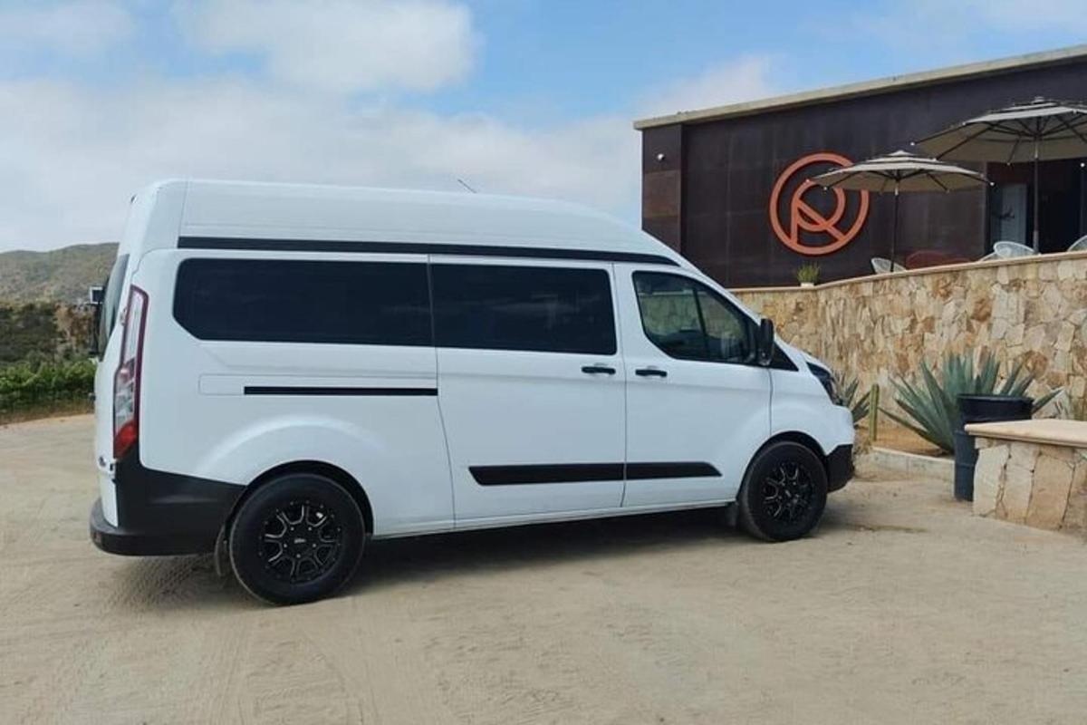 a white van parked in front of a building