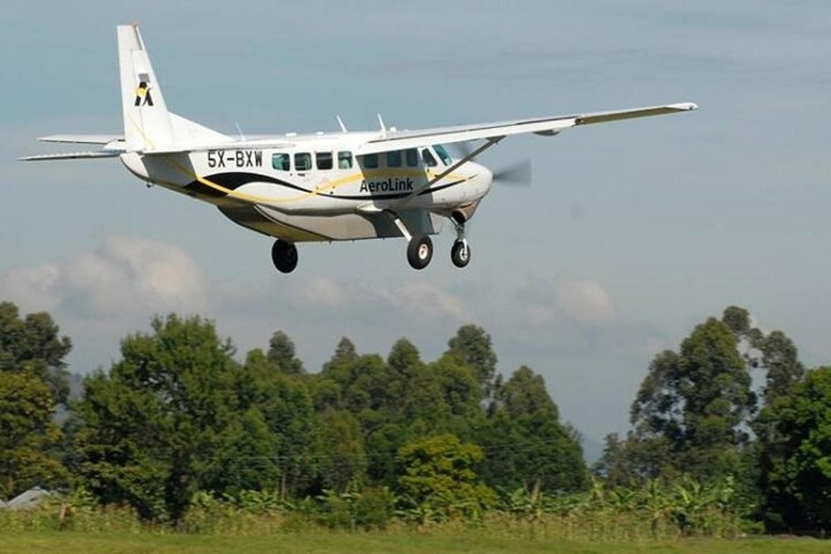 a small plane is flying over a field