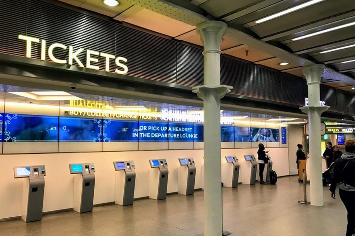 a row of parking meters in a subway station