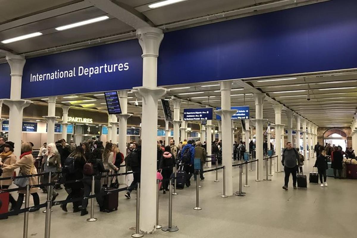 a group of people waiting at an airport
