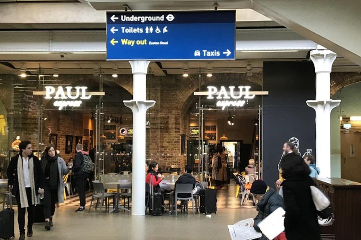 a group of people walking inside of a mall