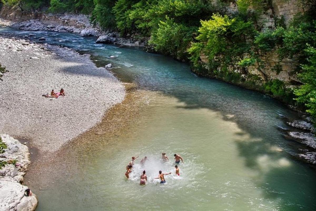 a group of people swimming in a river