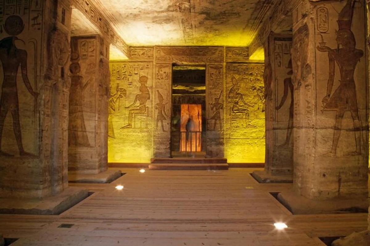 a room with paintings on the walls of an ancient building