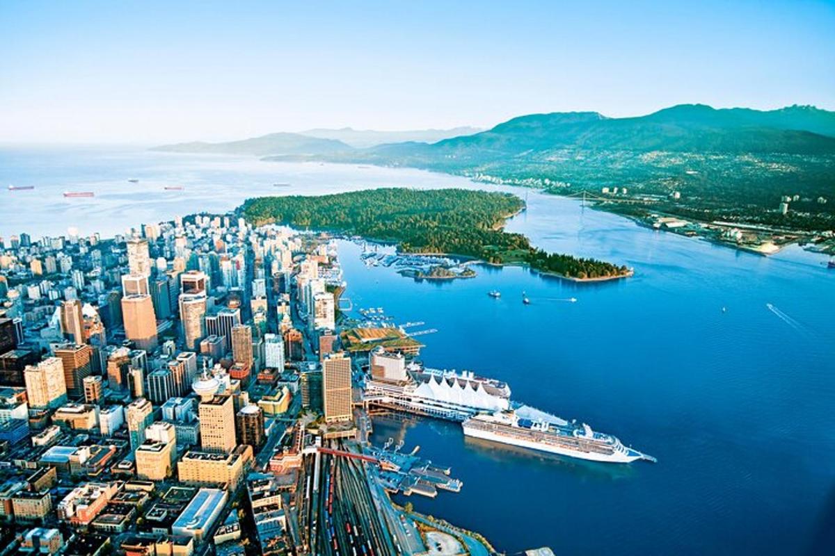 an aerial view of a large city next to the water