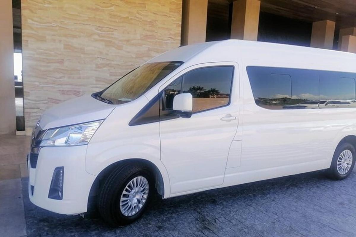 a white van parked in front of a building