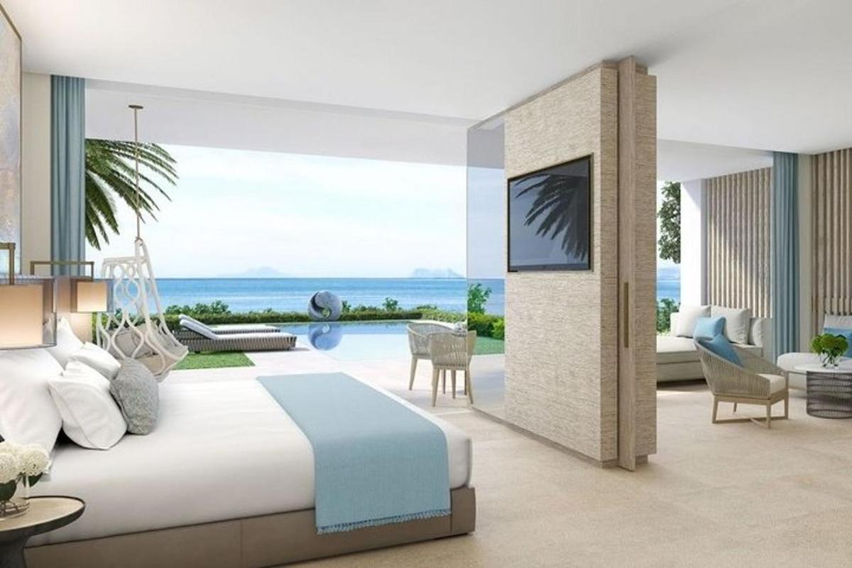 una camera da letto con un letto e vista sull'oceano