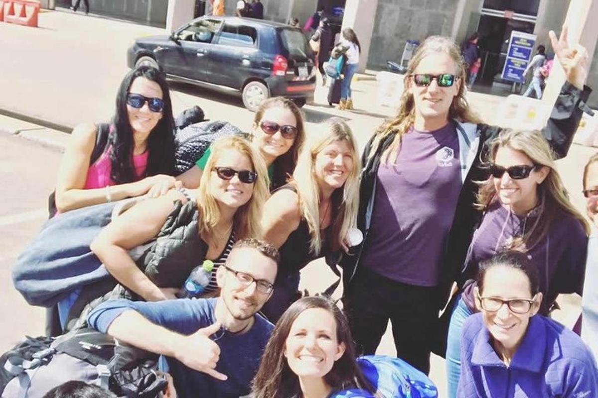 a group of people are posing for a picture