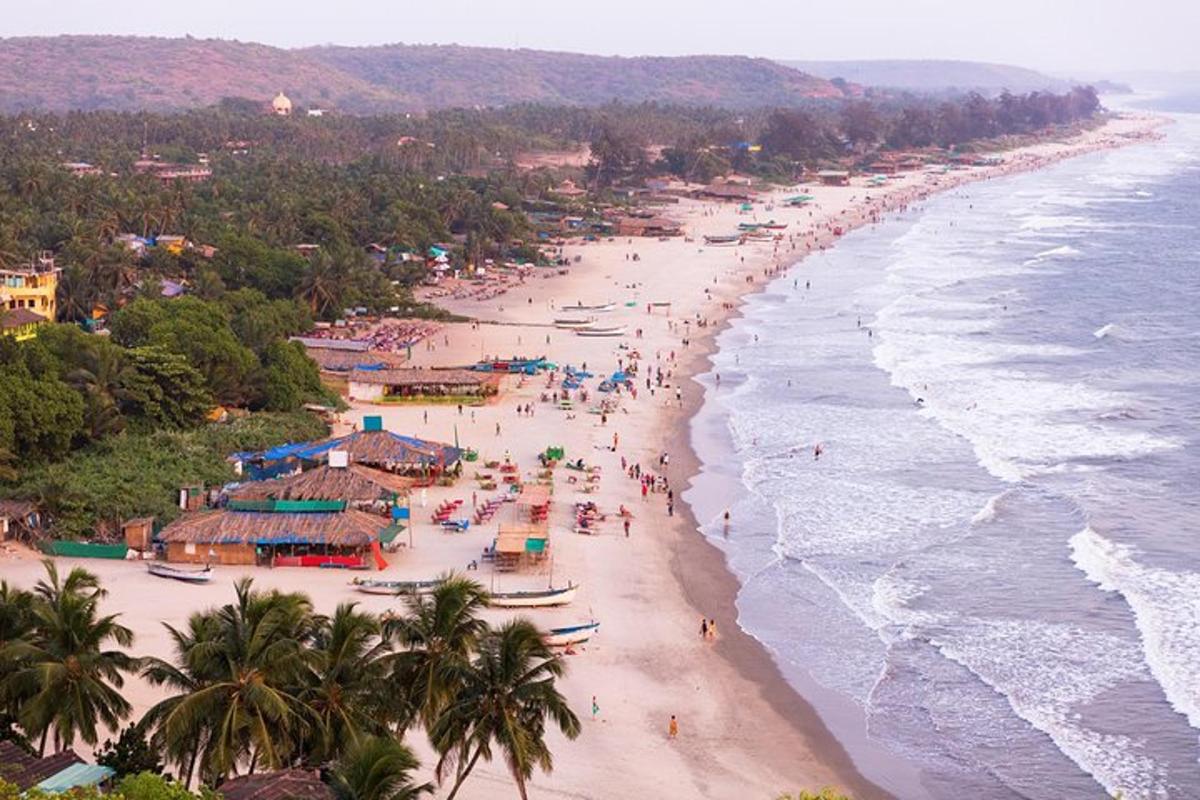 an overhead view of a beach with people and the ocean