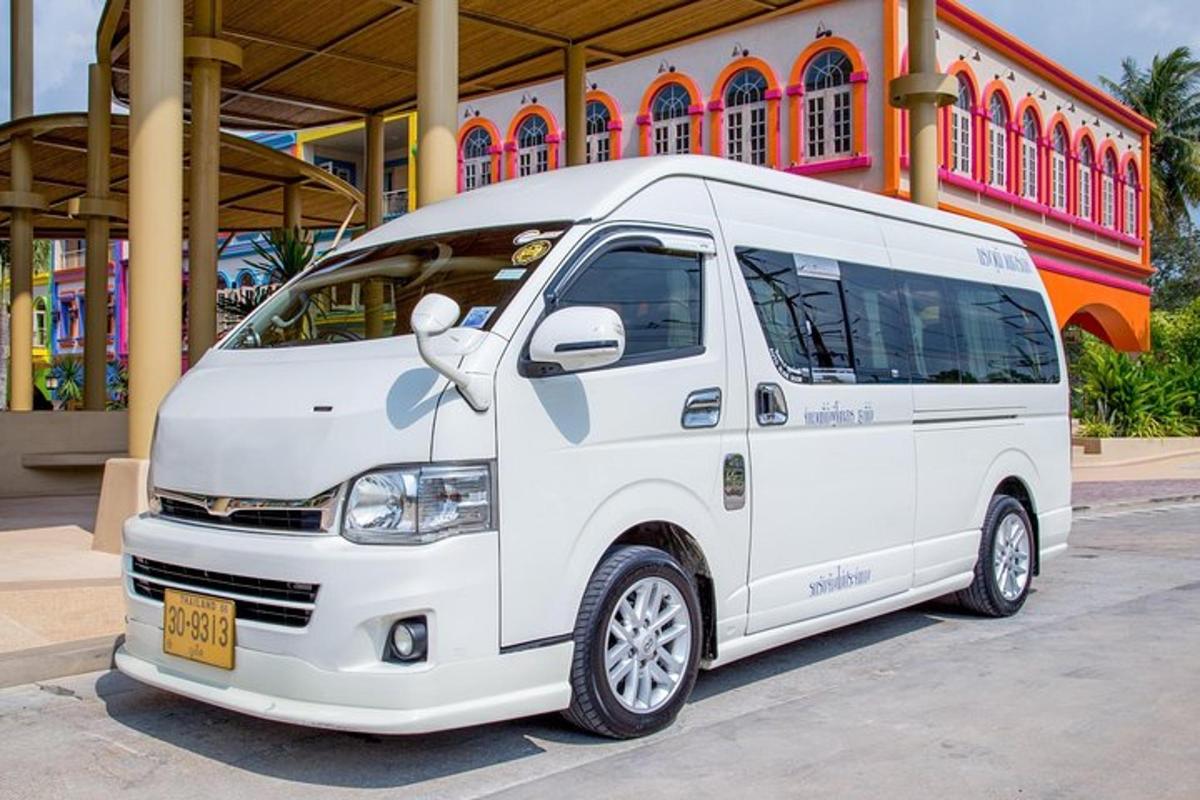 a white van parked in front of a building