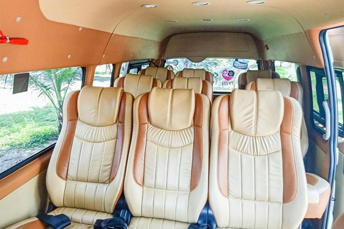a group of seats in the back of a bus