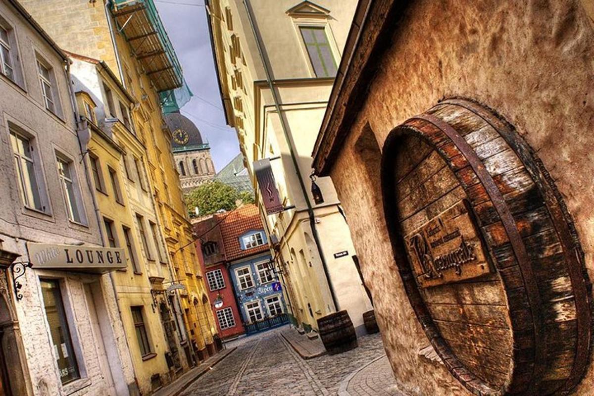 a large wooden barrel on the side of a building