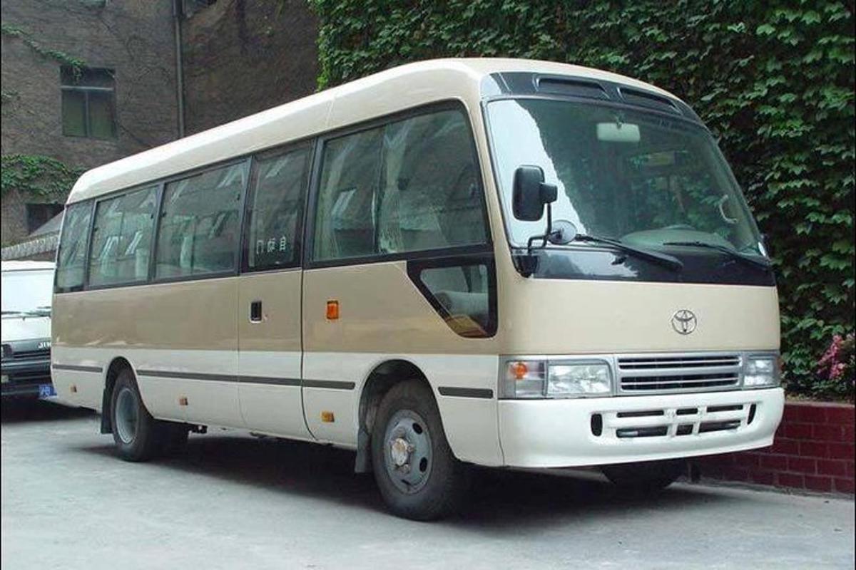 a white bus parked in a parking lot